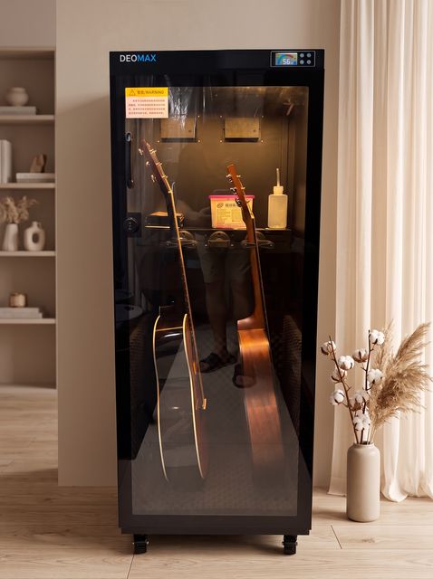 Two acoustic guitars in a DEOMAX cabinet with accessory shelf